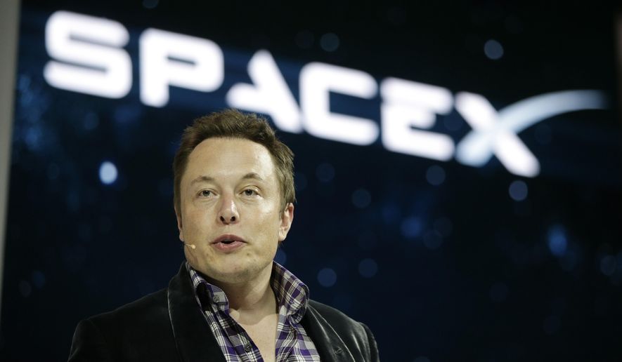 In this May 29, 2014, file photo, Elon Musk, CEO and CTO of SpaceX, introduces the SpaceX Dragon V2 spaceship at the SpaceX headquarters in Hawthorne, Calif. Musk predicted during an interview at the Code Conference in southern California on June 1, 2016, that people would be on Mars in 2025. (AP Photo/Jae C. Hong, File)