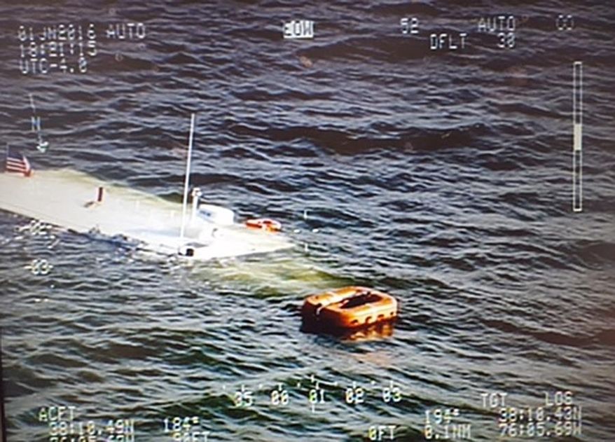 In this June 1, 2016 aerial photo released by the Maryland State Police, a charter boat belonging to the Chesapeake Bay Foundation lies in the Chesapeake Bay after sinking near Wingate, Md. A good Samaritan rescued more than 20 people, including schoolchildren, after the vessel sank Wednesday evening, authorities said. (Maryland State Police via AP)