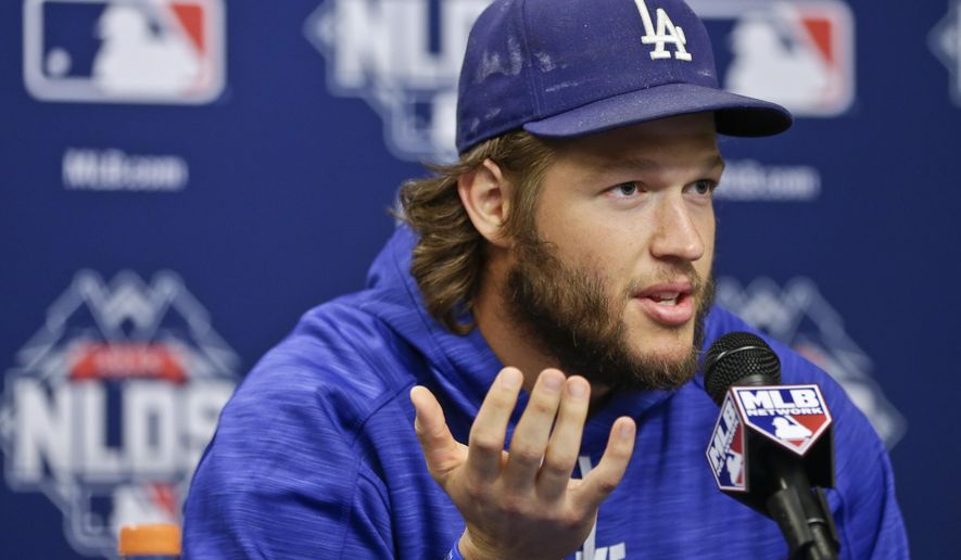 FILE - In this Oct. 12, 2015, file photo, Los Angeles Dodgers starting pitcher Clayton Kershaw speaks during a news conference before Game 3 of baseball&#39;s National League Division Series, at CitiField in New York. The IOC is set to readmit baseball for the 2020 Olympics in Tokyo. But top major league baseball players are unlikely to interrupt their season for a trip halfway around the world. “It’s not going to happen. I don’t think it’s fathomable.” Dodgers pitcher Clayton Kershaw said.  “I don’t know because 2020 will be my year before free agency,” Houston shortstop Carlos Correa added. (AP Photo/Frank Franklin II, File)