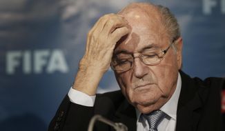 In this Dec. 19, 2014, file photo FIFA President Sepp Blatter attends a news conference in Marrakech, Morocco. Swiss attorney general&#39;s office confirms new raid Friday June 3, 21016, on FIFA, in ongoing investigations of Blatter and former FIFA secretary general Valcke. Both Blatter and Valcke deny wrongdoing. (AP Photo/Christophe Ena, FILE)