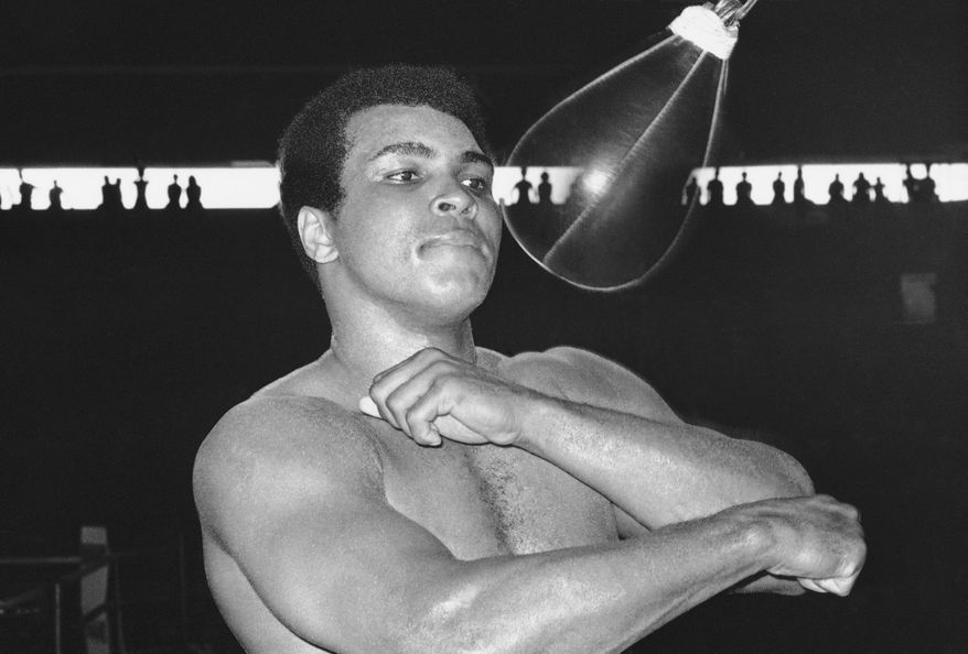 FILE - In this Sept. 29, 1975, file photo, Muhammad Ali punches a speed bag at the Folk Art Center in Manila, Philippines, as he prepares his title fight against Joe Frazier.  Ali, the magnificent heavyweight champion whose fast fists and irrepressible personality transcended sports and captivated the world, has died according to a statement released by his family Friday, June 3, 2016. He was 74. (AP Photo/Jess Tan, File)