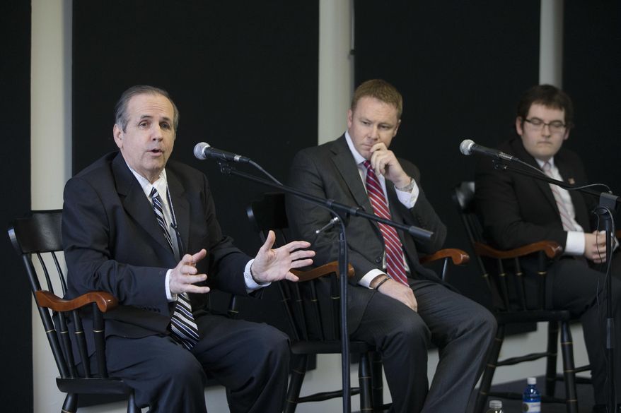 FILE - In this May 23, 2016 file photo, Green Party candidate Jim Condit Jr., left, speaks alongside Republican candidate Warren Davidson, center, and Democratic candidate Corey Foister, right, during a forum for candidates running in the 8th District special election at the Miami University Hamilton Downtown Center in Hamilton, Ohio. The stakes are high even if attention and interest are low in a special election Tuesday, June 7 to elect the successor to former House Speaker John Boehner. (AP Photo/John Minchillo)