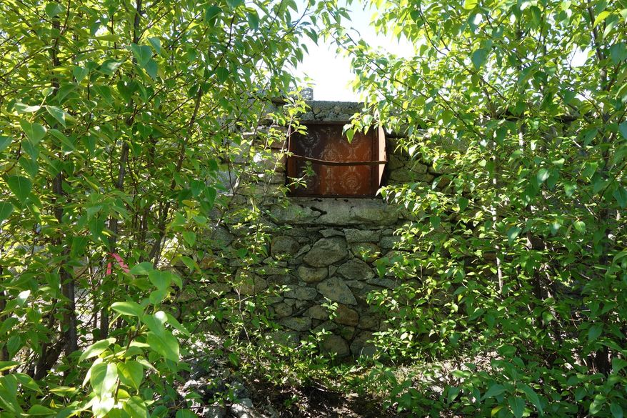ADVANCE FOR WEEKEND OF JUNE 4, 2016 One of the pieces by Katie Craney, wallpaper designed onto the metal of a coal chute, is seen in the Historic Fort William H. Seward Interpretive Sculpture Garden on May 14, 2016. (Randi Spray/Capital City Weekly via AP) MANDATORY CREDIT