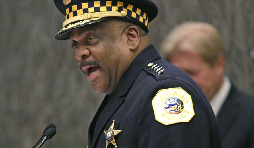 FILE - In this April 13, 2016, file photo, Eddie Johnson, left, speaks after being sworn in as the new Chicago police superintendent in Chicago. Violent crimes ranging from homicides to rapes to robberies have been on the rise in many major U.S. cities so far this year. But experts can't point to a single reason why and the jump isn't enough to suggest there's a trend. Law enforcement officials are seeking a way to combat the problem. (AP Photo/M. Spencer Green, File)