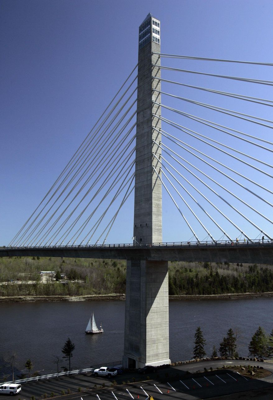 FILE- In this May 2007 file photo, the Penobscot Narrows Bridge dwarfs a sailboat passing underneath, in Prospect, Maine. The elevator serving the world's tallest bridge observatory has inconvenienced passengers on separate occasions by stranding them and forcing them to trudge down flights of stairs in the nine years since it opened, according to state documents. (AP Photo/Robert F. Bukaty, File)