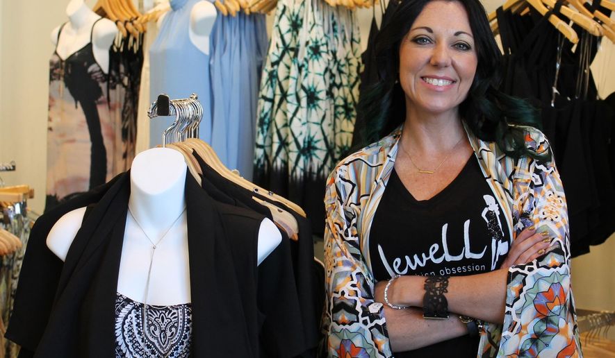 In this Friday, May 13, 2016 photo, Lacey Lichtenwalter poses in her second clothing boutique in Stones River Mall in Murfreesboro, Tenn. The newest fashion boutique in Murfreesboro is inspired by a love of fashion and family. A family owned and operated business, Jewell Fashion Obsession is named after owner Lacey Lichtenwalter’s grandfather, Jewell Hoskins. (Michelle Willard/The Daily News Journal via AP) NO SALES; MANDATORY CREDIT