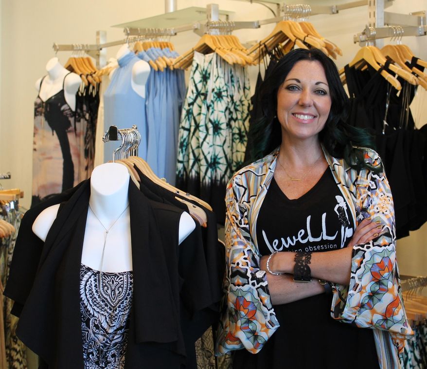 In this Friday, May 13, 2016 photo, Lacey Lichtenwalter poses in her second clothing boutique in Stones River Mall in Murfreesboro, Tenn. The newest fashion boutique in Murfreesboro is inspired by a love of fashion and family. A family owned and operated business, Jewell Fashion Obsession is named after owner Lacey Lichtenwalter’s grandfather, Jewell Hoskins. (Michelle Willard/The Daily News Journal via AP) NO SALES; MANDATORY CREDIT
