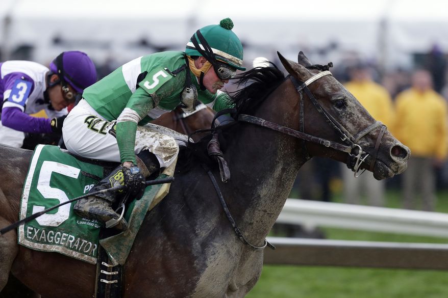 FILE - In this May 21, 2016, file photo, Exaggerator (5), with Kent Desormeaux, aboard moves past Nyquist, ridden by Mario Gutierrez, on the way to winning the 141st Preakness Stakes horse race at Pimlico Race Course in Baltimore. Next Saturday there'll be no Triple try. No Kentucky Derby winner, either. And no sellout crowd. Just Preakness winner Exaggerator taking on 3-year-olds he's already beaten and a few others in their first Triple Crown race. (AP Photo/Garry Jones, File)