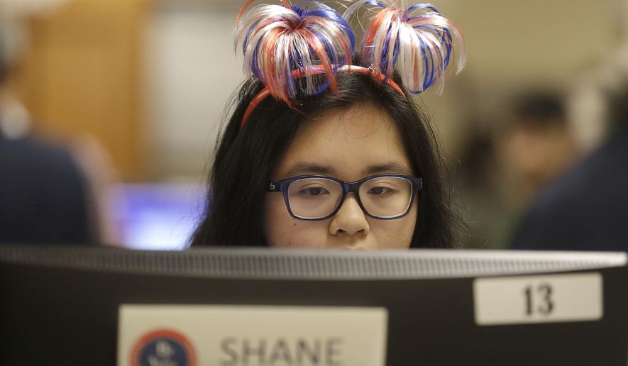 Department of Elections voter services worker Shane Agao works at City Hall in San Francisco, Tuesday, June 7, 2016. Voter turnout is expected to be higher then normal in the nation's most populous state for Tuesday's presidential primary. (AP Photo/Jeff Chiu)