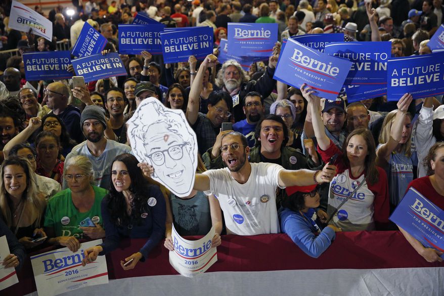 People cheer for Democratic presidential candidate Sen. Bernie Sanders, I-Vt., at a rally Tuesday, June 7, 2016, in Santa Monica, Calif. (AP Photo/John Locher)