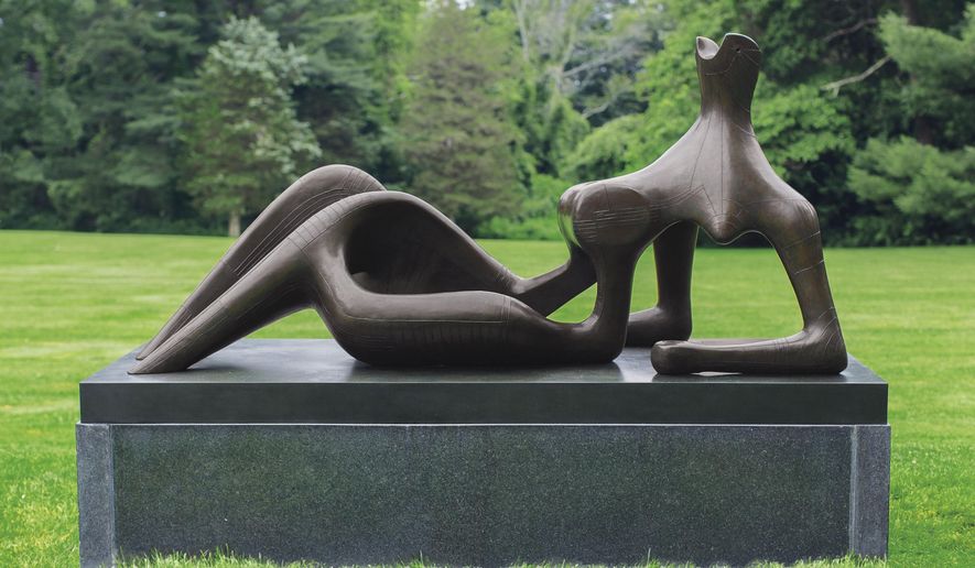 Undated handout pictured released by Christie's on Wednesday, June 8, 2016, of Henry Moore's modernist Sculpture "Reclining figure: festival" in London. The sinuous, 2.3 meter (7½ foot) -long bronze of a reclining woman was created for the 1951 Festival of Britain, which signaled the country's cultural resurgence after World War II and its austere aftermath. Christie's says "Reclining Figure: Festival" could fetch between 15 million pounds and 20 million pounds ($22 million and $29 million) at a June 30 sale. (Susan Young via AP)