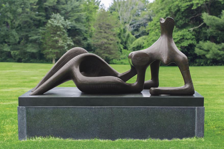 Undated handout pictured released by Christie's on Wednesday, June 8, 2016, of Henry Moore's modernist Sculpture "Reclining figure: festival" in London. The sinuous, 2.3 meter (7½ foot) -long bronze of a reclining woman was created for the 1951 Festival of Britain, which signaled the country's cultural resurgence after World War II and its austere aftermath. Christie's says "Reclining Figure: Festival" could fetch between 15 million pounds and 20 million pounds ($22 million and $29 million) at a June 30 sale. (Susan Young via AP)