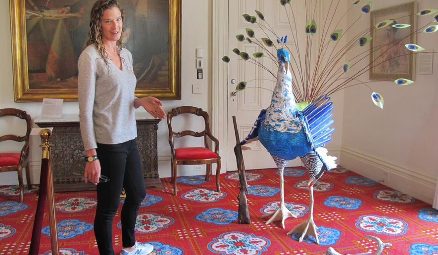 Artist Katie Hunt, the wife of Vermont Gov. Peter Shumlin, stands by an art display she created in the governor's ceremonial office in Montpelier, Vt., Wednesday June 8, 2016. Hunt, who has been married to the Democratic governor since December, says the art is meant to be a satirical look at their lives. Hunt did the sculptures as part of her senior thesis at Mount Holyoke College. Shumlin says he's proud of his wife's work. (AP Photo/Wilson Ring)