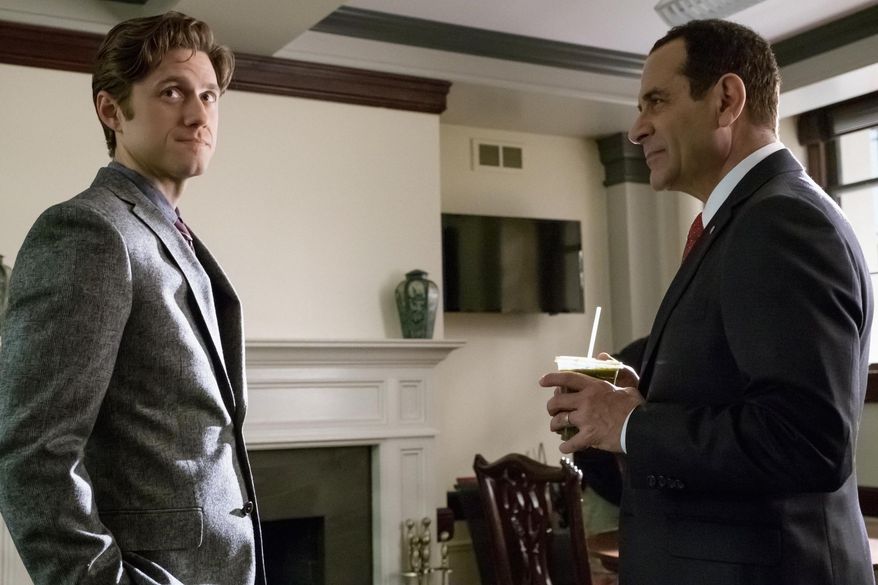 This image released by CBS shows Aaron Tveit, left, and Tony Shalhoub in a scene from "BrainDead," premiering June 13 on CBS. (Jeff Neumann/CBS via AP)
