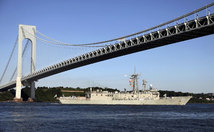 FILE- In this July 19, 2009 file photo, the Australian naval frigate HMAS Sydney passes under the Verrazano-Narrows Bridge as it enters New York Harbor. For over 50 years, the Metropolitan Transportation Authority has spelled the name of the bridge with a single z, but the Italian Italian explorer Giovanni da Verrazzano, whom the bridge is named after, spelled his name with two z's. (AP Photo/Craig Ruttle, File)