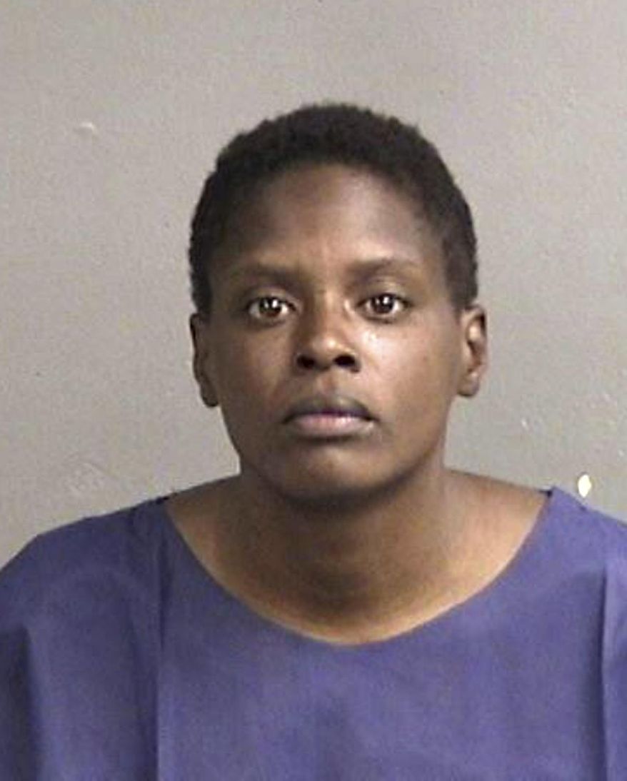 This June 2016 booking photo provided by the Alameda County Sheriff's Office shows Iyona Dzshae Hammond. Authorities say Hammond, accused of stabbing a 12-year-old boy in the back three times as she tried to rob a Northern California bank on Monday, June 6, is expected to be charged with attempted murder. The boy is in stable condition after surgery. (Alameda County Sheriff's Office via AP)