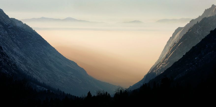 Particulates from an inversion fill the Salt Lake valley, as seen from the mountains southeast of Salt Lake City. (Associated Press)