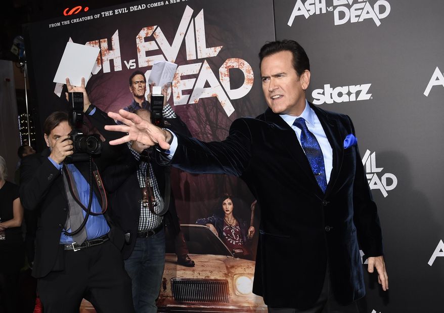 In this Oct. 28, 2015, file photo, Bruce Campbell, a cast member in the Starz television series "Ash vs Evil Dead," strikes a pose for photographers at the premiere of the film at TCL Chinese Theatre in Los Angeles. Campbell took to Twitter on Tuesday, June 7, 2016, to shoot down a tweet from a conservative Twitter account showing a bloodied woman who it said was a Donald Trump supporter attacked by liberals. Campbell said it was actually a makeup test photo for Samara Weaver, one of his "Ash" co-stars. (Photo by Chris Pizzello/Invision/AP, File)