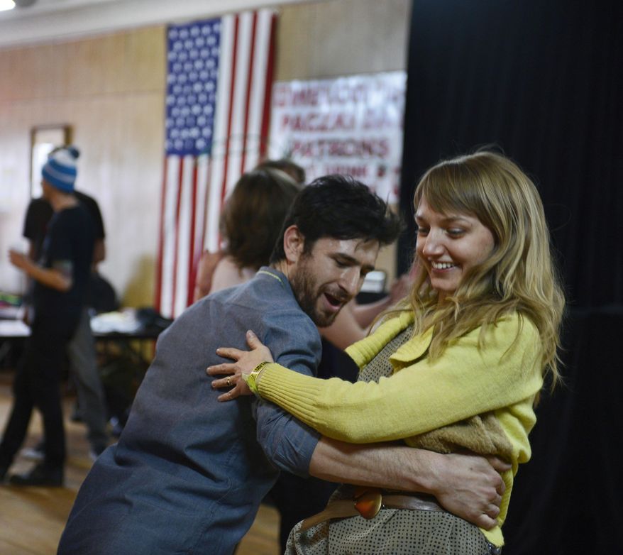 ADVANCE FOR MONDAY, JUNE 13 AND THEREAFTER - In a March 6, 2016 photo, Sam Newman of Detroit, dances with Jennie Knaggs of Detroit at a Detroit Square Dance Society dance at Hamtramck's P.L.A.V. 10 Hall during the Hamtramck Music Festival in Detroit. Four 30-something musicians started a monthly dance party called the Detroit Square Dance Society. They've been holding one square dance a month since November. (Donna Terek/The Detroit News via AP)
