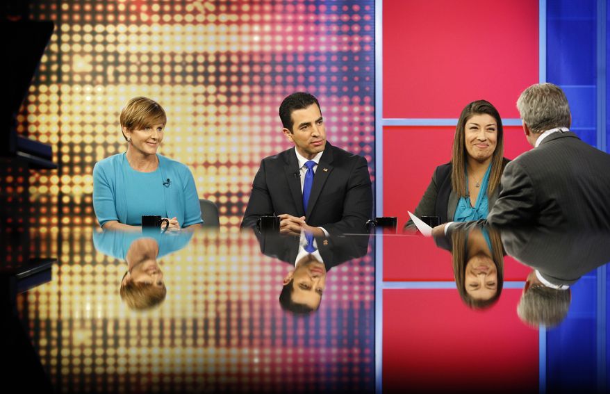 In this June 8, 2016, photo, Congressional candidates Susie Lee, from left, Ruben Kihuen and Lucy Flores take questions from journalist Jon Ralston, right, during a debate on Ralston Live, a PBS television show, in Las Vegas. The three are Democratic candidates for Nevada&#x27;s 4th Congressional District. (AP Photo/John Locher)