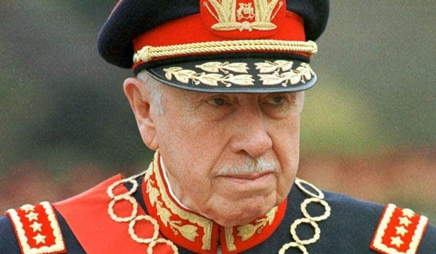 FILE - In this March 10, 1998 file photo, former Chilean dictator Gen. Augusto Pinochet is shown in Santiago, Chile. The ghosts of Chile&#39;s four-decade-old, bloody coup d&#39;etat, which led to the torture, and disappearance of thousands of political opponents, are coming to an Orlando, Florida courtroom with the start of a civil trial involving a military commander and the family of Victor Jara. The family of Jara is suing Lt. Pedro Pablo Barrientos Nunez, a former military officer in the regime of Gen. Augusto Pinochet for damages, claiming that Barrientos Nunez was in charge of the stadium where Jara was tortured and killed in 1973. The trial starts in Orlando, Fla., Monday, June 13. 2016.(AP Photo/Santiago Llanquin, File)