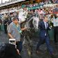 Part owner Bobby Flay (right) leads Creator, with jockey Javier Castellano, into the Winner&#39;s Circle, after Creator won the Belmont Stakes on Saturday. (Associated Press)