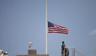 The American flag is flown at half staff over the White House in Washington, Sunday, June 12, 2016, after President Barack Obama spoke about the massacre at an Orlando nightclub.  (AP Photo/Manuel Balce Ceneta)