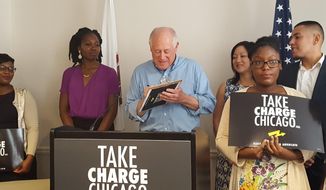 Former Illinois Gov. Pat Quinn kicks off a petition drive to put a two-term limit on Chicago&#x27;s mayor, and to create an elected citywide consumer advocate position Sunday, June 12, 2016 in Chicago. The Chicago Democrat added his name to the petition during a news conference in downtown Chicago (AP Photo by Sophia Tareen).