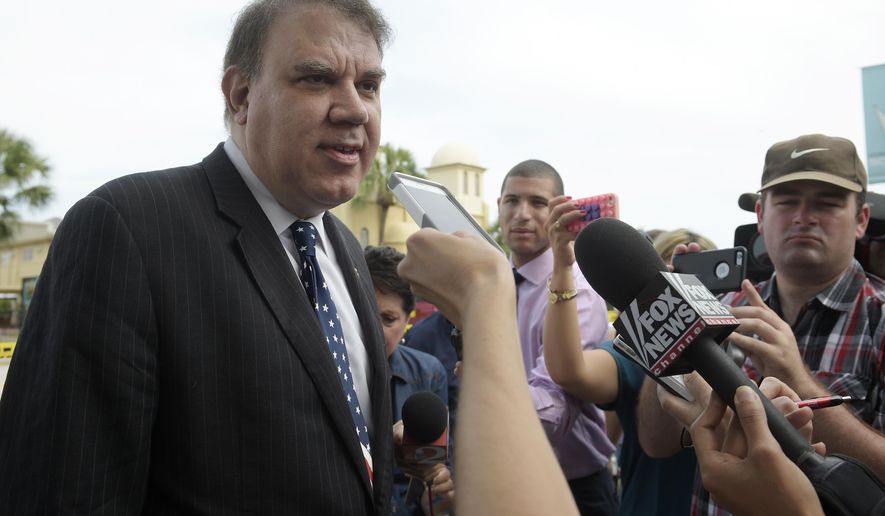 Rep. Alan Grayson, D-Fla., left, answers questions from reporters after being briefed by law enforcement officials following a shooting involving multiple fatalities at a nightclub in Orlando, Fla., Sunday, June 12, 2016. (AP Photo/Phelan M. Ebenhack)