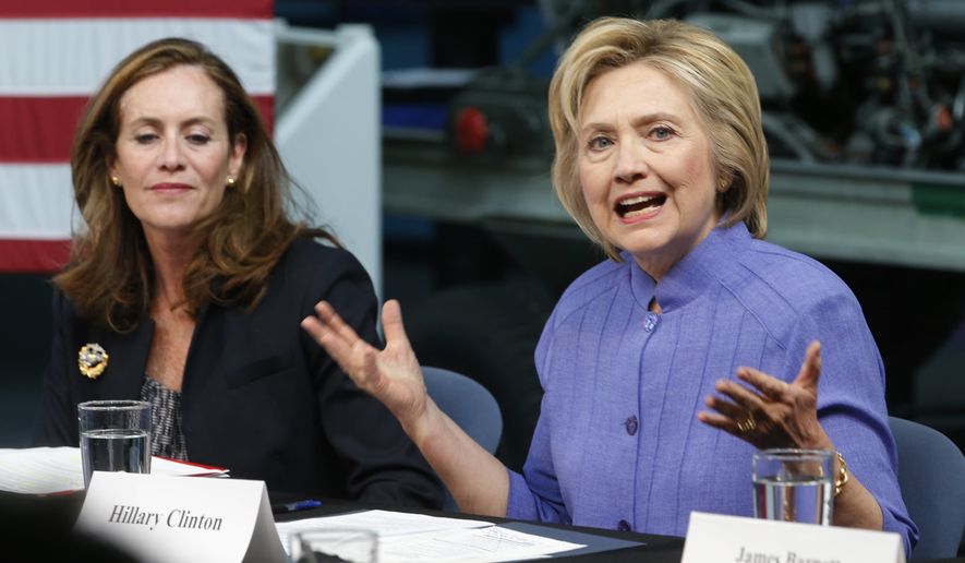 Democratic Presidential candidate Hillary Clinton, accompanied by Virginia first lady Dorothy McAuliffe, gestures as she speaks on national security, Wednesday, June 15, 2016, in Hampton, Va. (AP Photo/Steve Helber)