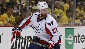 In this May 2, 2016 file photo, Washington Capitals&#39; Karl Alzner (27) skates during the first period of Game 3 in an NHL hockey Stanley Cup Eastern Conference semifinals against the Washington Capitals in Pittsburgh. Alzner had sports hernia surgery, Wednesday, June 15, 2016, and the team says it expects him to be  &quot;completely healthy&quot; before the start of next season. (AP Photo/Gene J. Puskar)