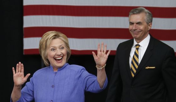 Democratic Presidential candidate Hillary Clinton waves as she arrives for a speech on national security with retired Adm, James Barnett, Wednesday, June 15, 2016, in Hampton, Va. (AP Photo/Steve Helber)