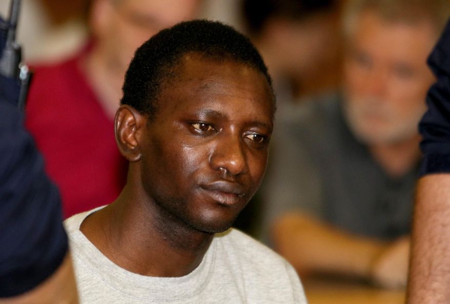 Abdou I. (no second name given) from Gambia waits for the start of his trial at the main court in Vienna, Austria, Wednesday, June 15, 2016. He is suspected to be the murderer of a 25-year old au pair girl from Colorado, United States who lived in Vienna. (AP Photo/Ronald Zak)