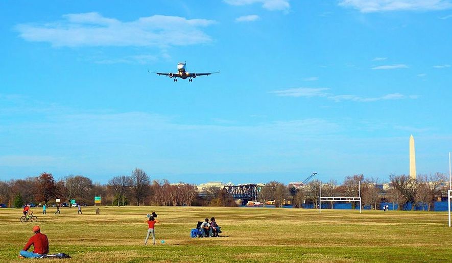 An airplane landing at Reagan National Airport, over Gravelly Point Park — which some say should be renamed Nancy Reagan Memorial Park. (ted eylan)