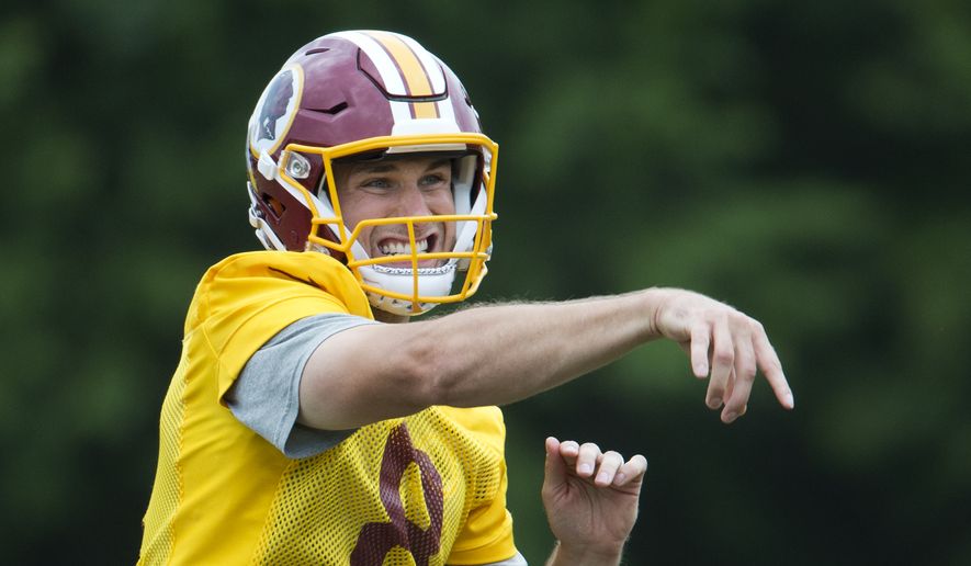 Washington Redskins starting quarterback Kirk Cousins (8), grimaces as he throws the ball during the NFL football team&#39;s minicamp at the Redskins Park in Ashburn, Va., Wednesday, June 15, 2016. (AP Photo/Manuel Balce Ceneta)