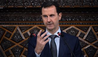 Syrian President Bashar Assad addresses the newly-elected parliament in Damascus, Syria, on June 7. (Associated Press)