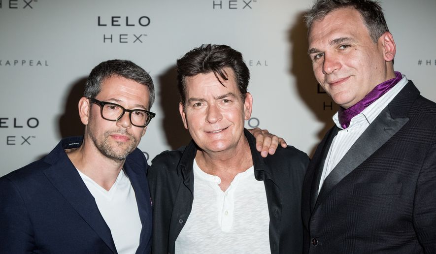 From left, "Lelo Hex" co-founder Miroslav Slavic, U.S. actor Charlie Sheen and fellow co-founder Filip Sedic after a press conference to celebrate the launch of the condom brand "Lelo Hex" in London, Thursday June 16, 2016. (Photo by Vianney Le Caer/Invision/AP)