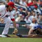 Washington Nationals third baseman Anthony Rendon reaches to tag out Chicago Cubs&#39; Jason Heyward while attempting to steal third base base in first inning Wednesday. (AP Photo/Alex Brandon)