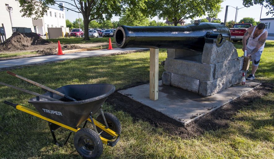 This June 17, 2016 photo shows a 13-inch replica Civil War cannon being installed at Battery Park on Center Avenue in Bay City, Mich. (Jacob Hamilton/The Bay City Times - MLive.com via AP)