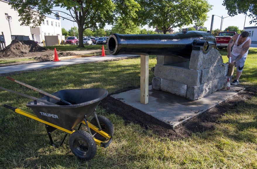 This June 17, 2016 photo shows a 13-inch replica Civil War cannon being installed at Battery Park on Center Avenue in Bay City, Mich. (Jacob Hamilton/The Bay City Times - MLive.com via AP)