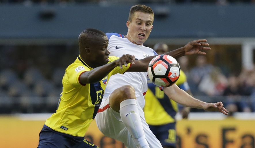 United States&#x27; Matt Besler, right, and Ecuador&#x27;s Enner Valencia fight for the ball during a Copa America Centenario quarterfinal soccer match, Thursday, June 16, 2016 at CenturyLink Field in Seattle. The U.S. won the match 2-1. (AP Photo/Elaine Thompson)
