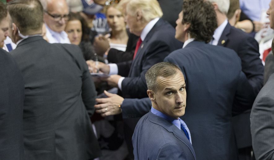 FILE - In this April 18, 2016 file photo, Republican presidential candidate Donald Trump&#39;s campaign manager Corey Lewandowski walks a rope line as the candidate signs autographs during a campaign stop at the First Niagara Center in Buffalo, N.Y.  Trump has forced out his hard-charging campaign manager, Lewandowski, in a dramatic shakeup designed to calm panicked Republican leaders and reverse one of the most tumultuous stretches of Trump&#39;s unconventional White House bid. (AP Photo/John Minchillo, File)