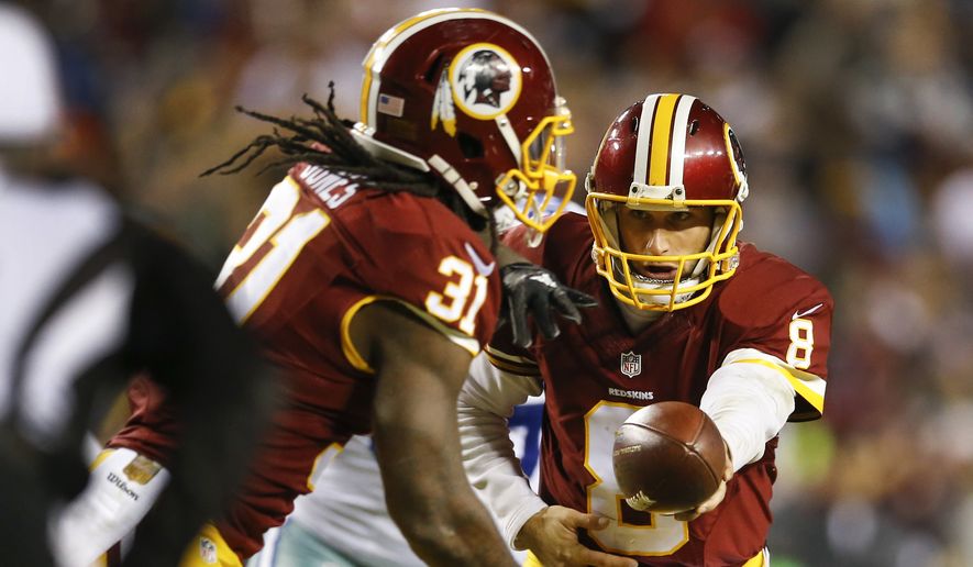 In this photo taken Dec. 7, 2015, Washington Redskins running back Matt Jones (31)  gets a hand off from quarterback Kirk Cousins (8) during the first half of an NFL football game against the Dallas Cowboys in Landover, Md. Jones finds it strange not to see Alfred Morris in the Washington Redskins huddle. With Morris gone, the No. 1 running back job is his. Jones knows that going into next season. During offseason workouts, hes trying to tighten his grip on the football because hell be getting the majority of the carries moving forward. (AP Photo/Patrick Semansky)