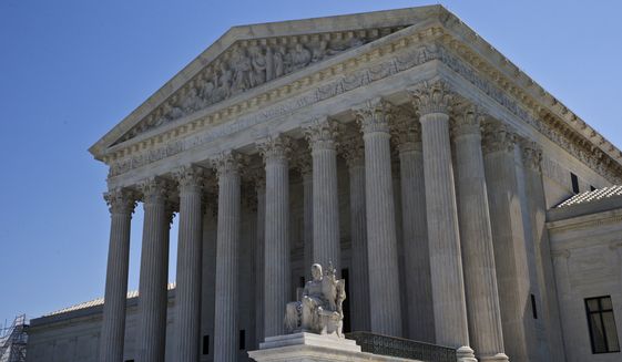 In this June 20, 2016, photo, The Supreme Court is seen in Washington. The eight-justice court has eight cases to resolve in the waning days of a trying and mournful term since the death of Justice Antonin Scalia in February. (AP Photo/Alex Brandon)