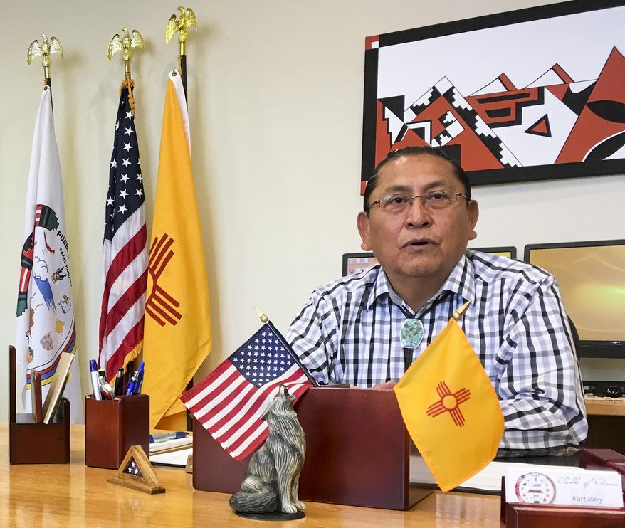 In this June 8, 2016, photo, Gov. Kurt Riley, of Acoma Pueblo, discusses his tribe's move to repatriate a ceremonial shield from Paris, France during an interview in Acoma Pueblo, New Mexico. Amid protest from the Pueblo, the shield was pulled from the auction block in a rare, last-minute move that has been hailed by tribes and questioned by some collectors. (AP Photo/Mary Hudetz)