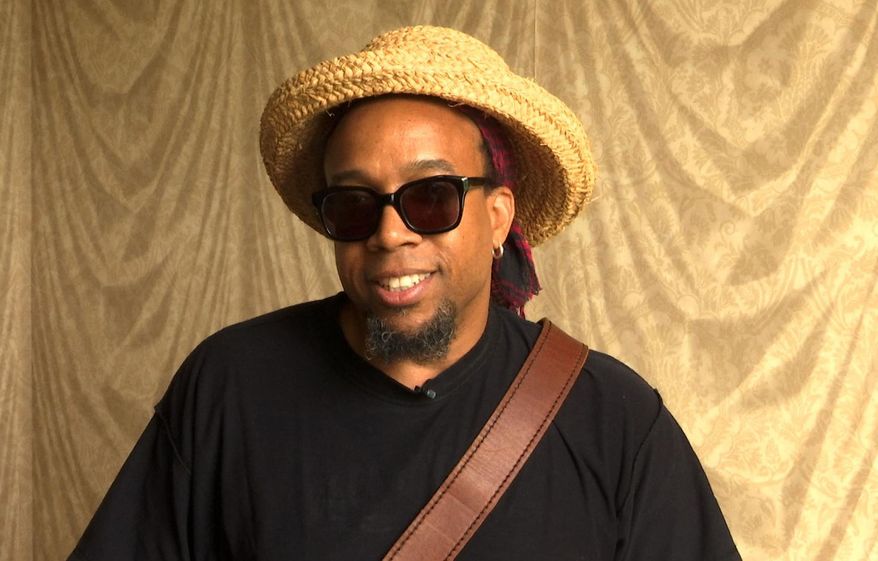 In this June 20, 2016 photo taken from video, rapper Speech, the frontman for the hip hop group Arrested Development, poses during an interview in Nashville, Tenn. The group is still making music on their own terms by releasing two new albums this year, one that is a free download and another one for sale. (AP Photo/Kristin M. Hall)