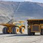 Giant copper ore trucks in open pit mine (Photo: Shutterstock)