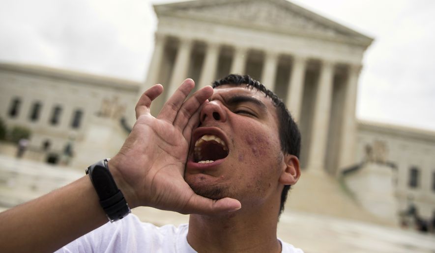 Gerson Quinteron of Washington yells during a demonstration on immigration at the Supreme Court on Thursday. A tie vote by the Supreme Court is blocking President Barack Obama&#39;s immigration plan that sought to shield millions living in the U.S. illegally from deportation. The justices&#39; one-sentence opinion effectively kills the plan for the duration of Obama&#39;s presidency. (Associated Press)