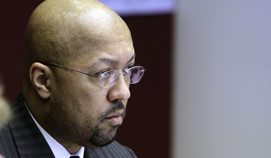 FILE- In an April 12, 2011 file photo, then Detroit City Council President Charles Pugh is seen during a council meeting in Detroit. The former councilman, who quit in 2013, has been charged with criminal sexual conduct in a case involving a 14-year-old boy a decade earlier. The Wayne County prosecutor's office says 44-year-old Charles Pugh was arrested Thursday, June 23, 2016, at his home in New York City, a day after being charged. He's awaiting extradition. If convicted, he faces up to life in prison. (AP Photo/Carlos Osorio, File)