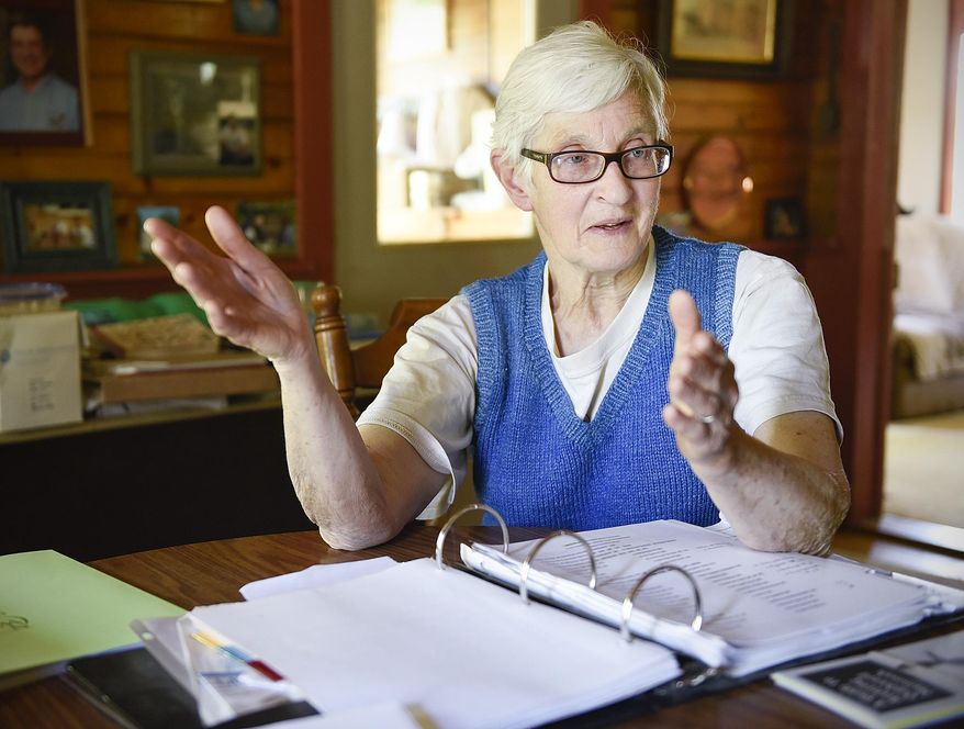 Linda Peck shows records of each call she gets about an injured animal on May 26, 2016, at her farm in Rockville, Minn. Peck is one of about 75 licensed wildlife rehabilitators in Minnesota, according to Heidi Cyr, Minnesota Department of Natural Resources wildlife rehabilitation program coordinator, DNR falconry program coordinator and issuer of wildlife education permits. She's working to update the list of licensed rehabilitators and put everything online. (Jason Wachter/St. Cloud Times via AP) NO SALES; MANDATORY CREDIT